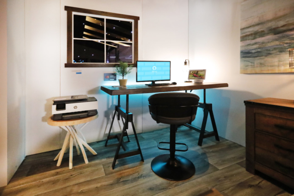 Wooden desk with alexa tech on it