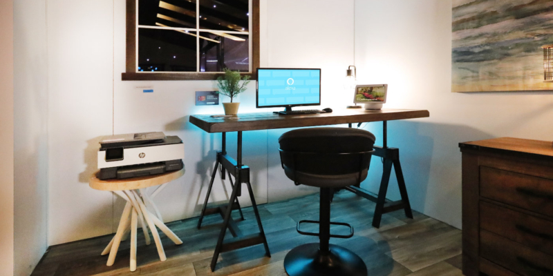 Wooden desk with alexa tech on it